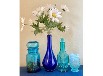 Collection Of Blue Glass Bottles And Vases