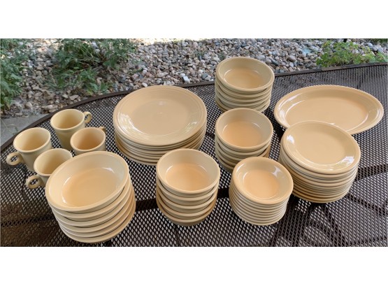 A Large Collection Of Yellow Fiesta Ware