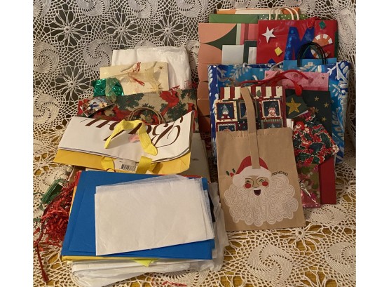 An Assortment Of Gift Bags, Tissue Paper And Ribbon.