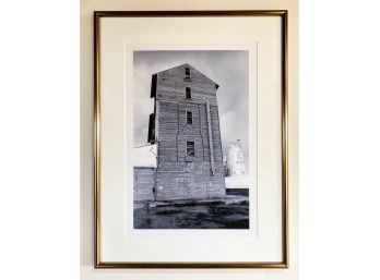 Framed Photograph Of Old Building With Coop Feed Building In Background