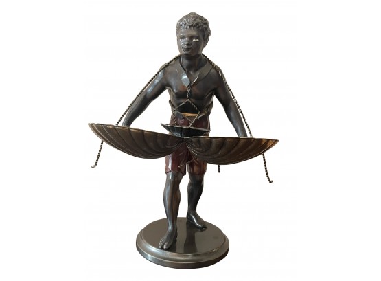 Statue Of Man With 3 Shells By Petites Choses USA