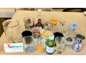 Lot Of Shot Glasses And Small Alcohol Bottles