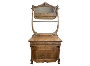 Antique QuarterSwan Oak Vanity With Cherub Carving And Brass Handles