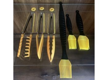 Collection Of Black And Yellow Cooking Utensils.