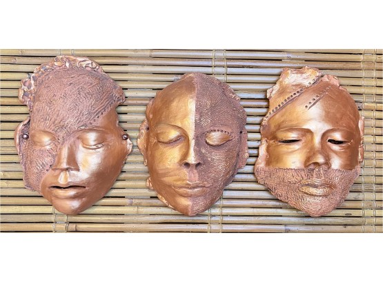 Three Copper Colored Ceramic Masks