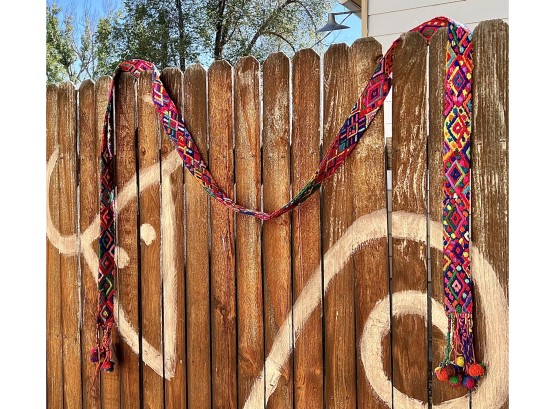 Colorful Hand Woven Wall Hanging From Extended Hands