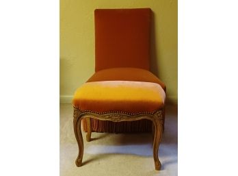 Vintage Velvet Orange Upholstered Chair With Fringe And Matching Studded Wooden Footstool.