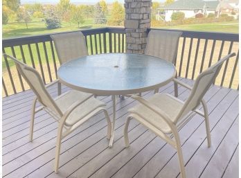 Outside Metal And Glass Patio Table With 4 Chairs.