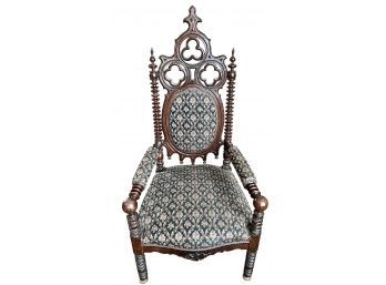Antique Gothic Revival Arm Chair With Ornately Carved Wood And Newer Black Jacquard Fabric