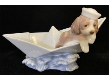 Lladro 6642 'Little Stowaway' Puppy Dog Adrift In A Paper Boat.