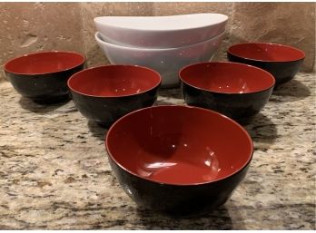 Two White Glass Oval Bowls From Crate And Barrel With Five Plastic Red And Black Sauce Bowls