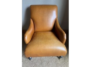 Brown Leather Chair With Tacking On The Side And Casters On The Front 2 Feet