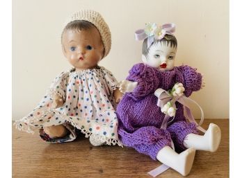 2 Vintage Dolls 1 Seated Composition Body Has Cracks , 1 Porcelain With Purple Dress