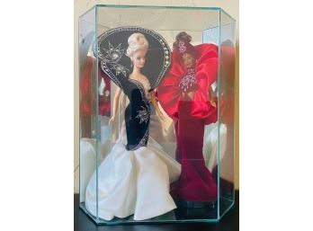 Two Beautiful Barbies In Glass Display Case
