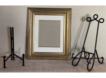 (2) Picture/plate Stands And A Be Picture Frame