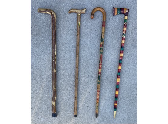 4 Wooden Canes With Various Colors And Shapes
