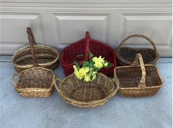 Collection Of 6 Wicker Baskets Including Red Basket With Faux Flowers
