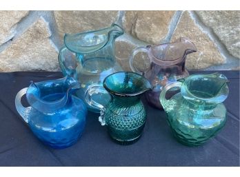 Collection Of Various Colored Small Vintage Glass Pitchers