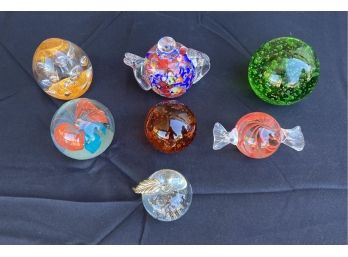Collection Of 7 Assorted Clear/Colorful Glass Paperweights Of Varying Sizes