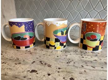 Three Colorful Coffee Mugs Featuring Pears, Lemons And Apples