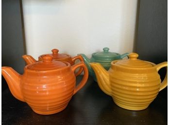 Four Miniature Ringware Pattern Bauer Teapots Two Orange, One Teal, One Yellow