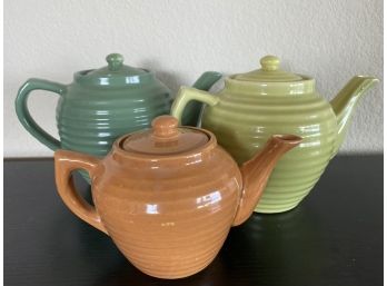 Collection Of Three Bauer Ringware Teapots In Various Sizes And Neutral Tones