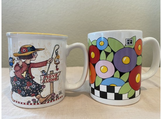 Pair Of Two Mary Engelbreit Mugs Including “Move Along” And Blossoms Mug