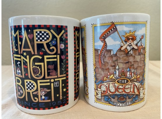 Pair Of Two Mary Engelbreit Mugs Including “The Queen Of Everything” And “Mary Engelbreit Since 1952”
