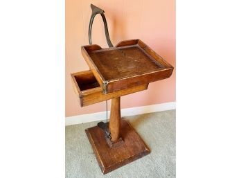Antique Cast Iron Vise On Wood Stand With Foot Pedal Opening Mechanism Was Used As A Side Table