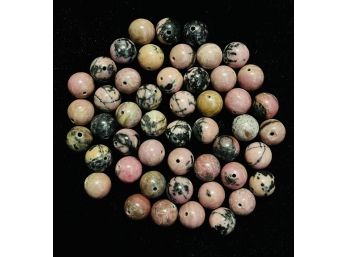 Grouping Of Pink Rhodonite With Black Matrices Bead