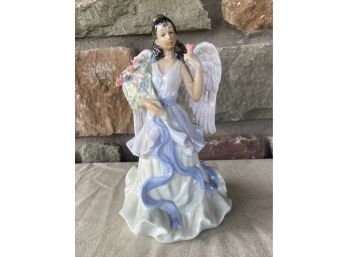 Small Musical Angel Figurine With Roses