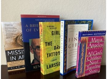 Group Of Books Including Maya Angelou, Stieg Larsson, & Alan Huffman