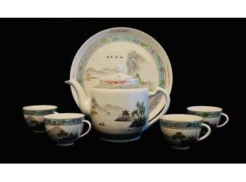 Chinese Teapot With Teacups And A Plate