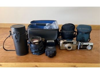 Assorted Collection Of Cameras & Lenses Including Hyundai, Sunpak, & More