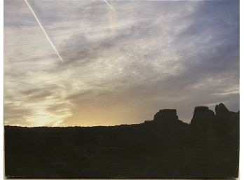 Mesa Silhouette Against A Setting Sun