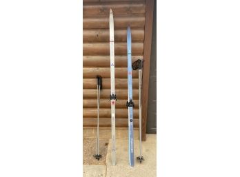 2 Pairs Of Fischer Skis With 4 Poles