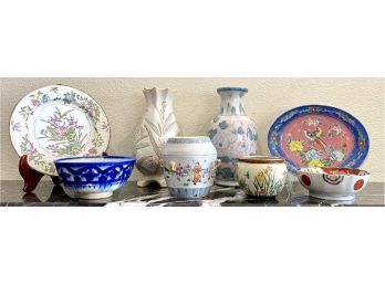 (9) Floral Asian Influence Pottery Pieces Including Two Large Vases A Covered Jar And Two Plates