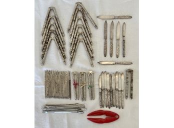 Assortment Of Nutcrackers & Silver Plate Silver Forks, Picks And Small Cheese Knifes