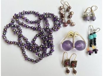 Collection Of Purple Toned Jewelry Including Necklace And Earrings