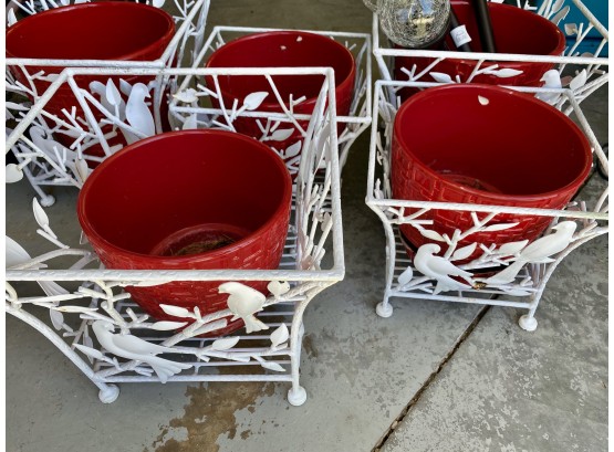 White Wrought Iron Plant Baskets With Red Ceramic Pots And Solar Lights