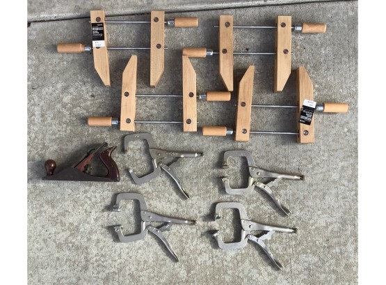 Group Of Wood And Metal Clamps With A Craftsman Planer