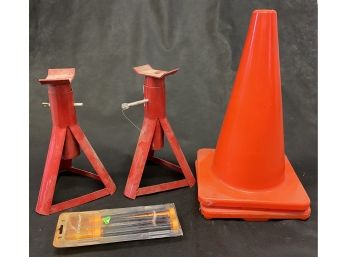 2 Red Jack Stands, 2 Orange Plastic Cones, And An Electro Flare Kit