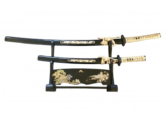 Collection Of Two Japanese Swords With Carved Handles On Black And Gold Lacquered Stand