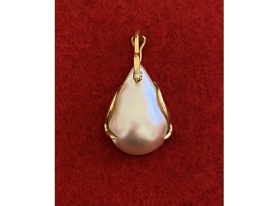 14k Gold Mother Of Pearl Pendant With Tiny Diamond From Garwood Jewelers