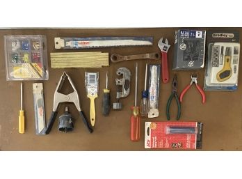 Collection Of Assorted Hand Tools Including Blades, Fuses, And More