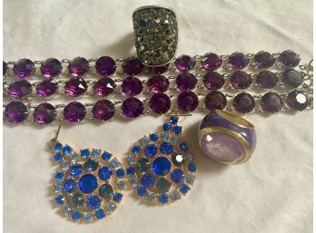 Collection Of Rhinestone Jewelry Including Earrings, Bracelets, And Rings