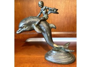 Sculpture Of A Boy Riding A Dolphin