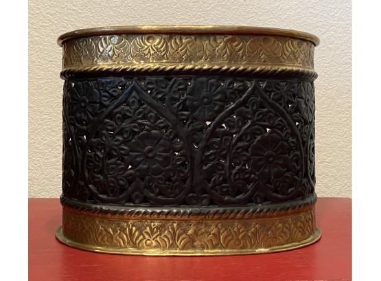Pierced Black Oval Urn With Gold Decorative Rim And Base