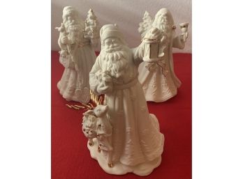 (3) Porcelain Cream Colored Santa Figurines With Gold Trim