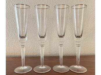 Four Lenox Champagne Flutes With Silver Rim